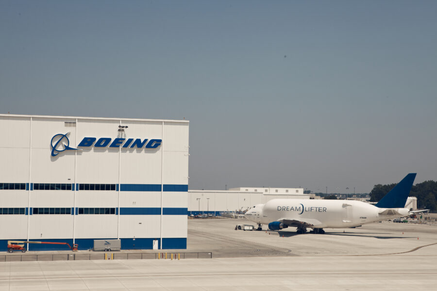 Boeing Dreamlifter aircraft parked outside the Boeing facility.