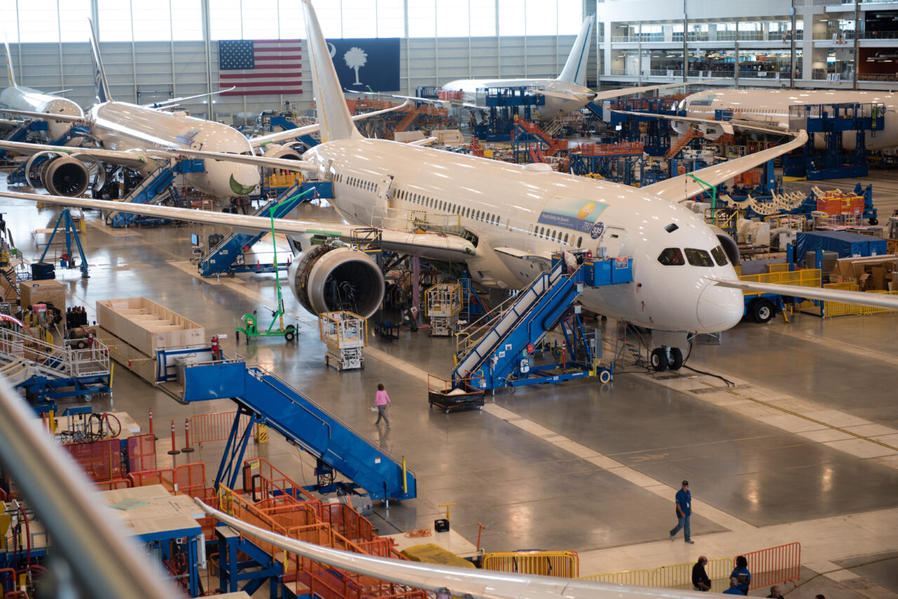 Four passenger airplanes sit in a hangar in the Charleston region.