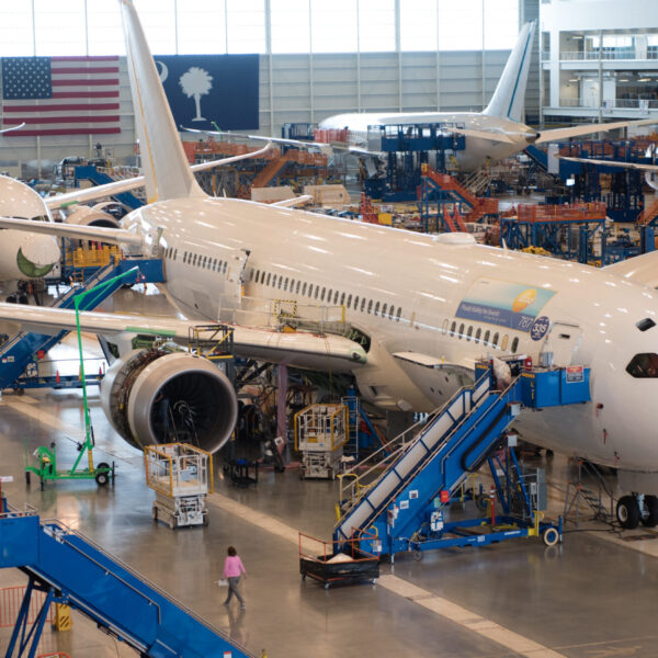 Four passenger airplanes sit in a hangar in the Charleston region.