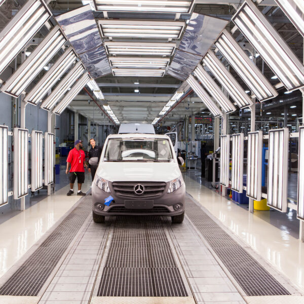 A Mercedez van in a manufacturing facility.